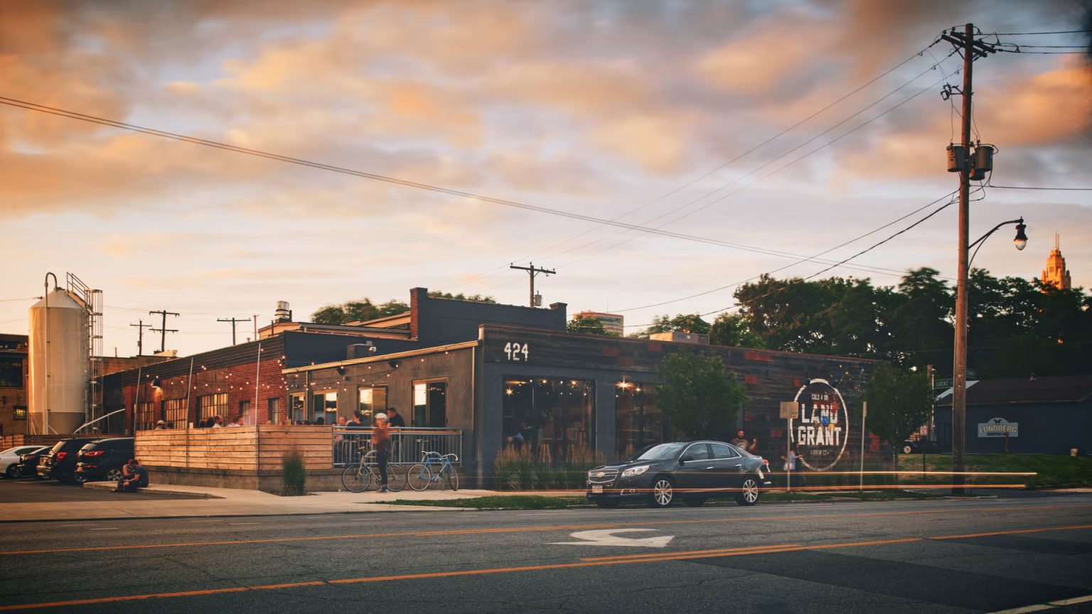 Land-Grant Brewing Co. in Franklinton at sunset with the LeVeque Tower in the background