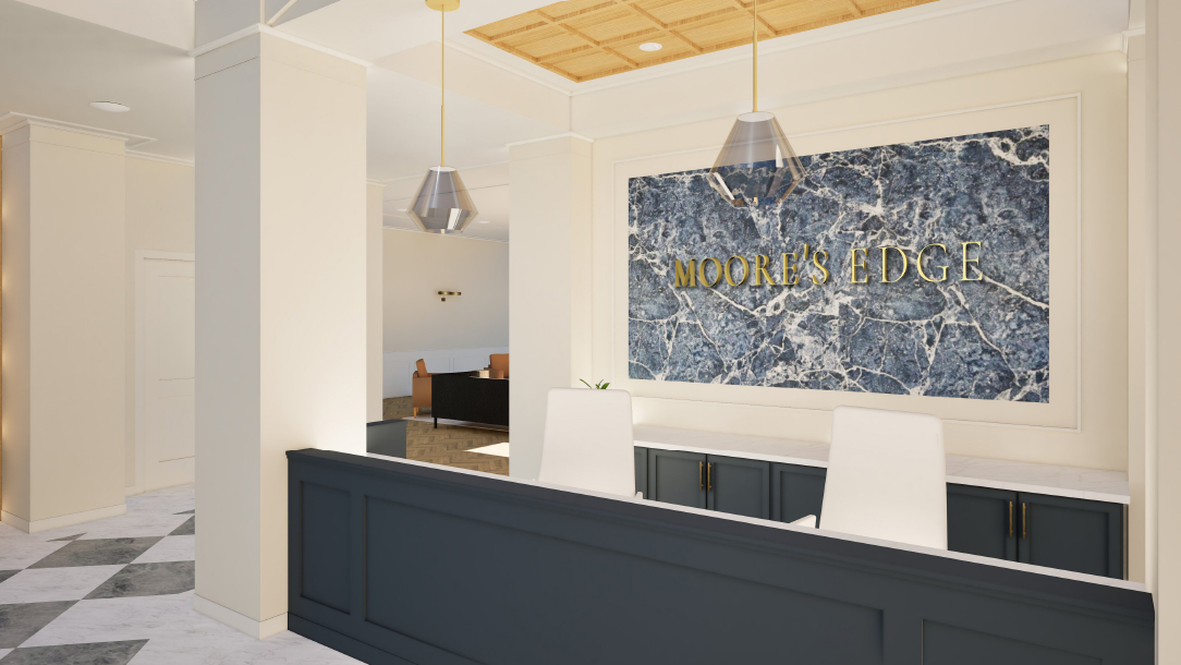 Thrive Companies, Reception area with a dark blue front desk, two white chairs, and a large blue marble sign on the wall reading MOORES EDGE. Apartments in Columbus Ohio