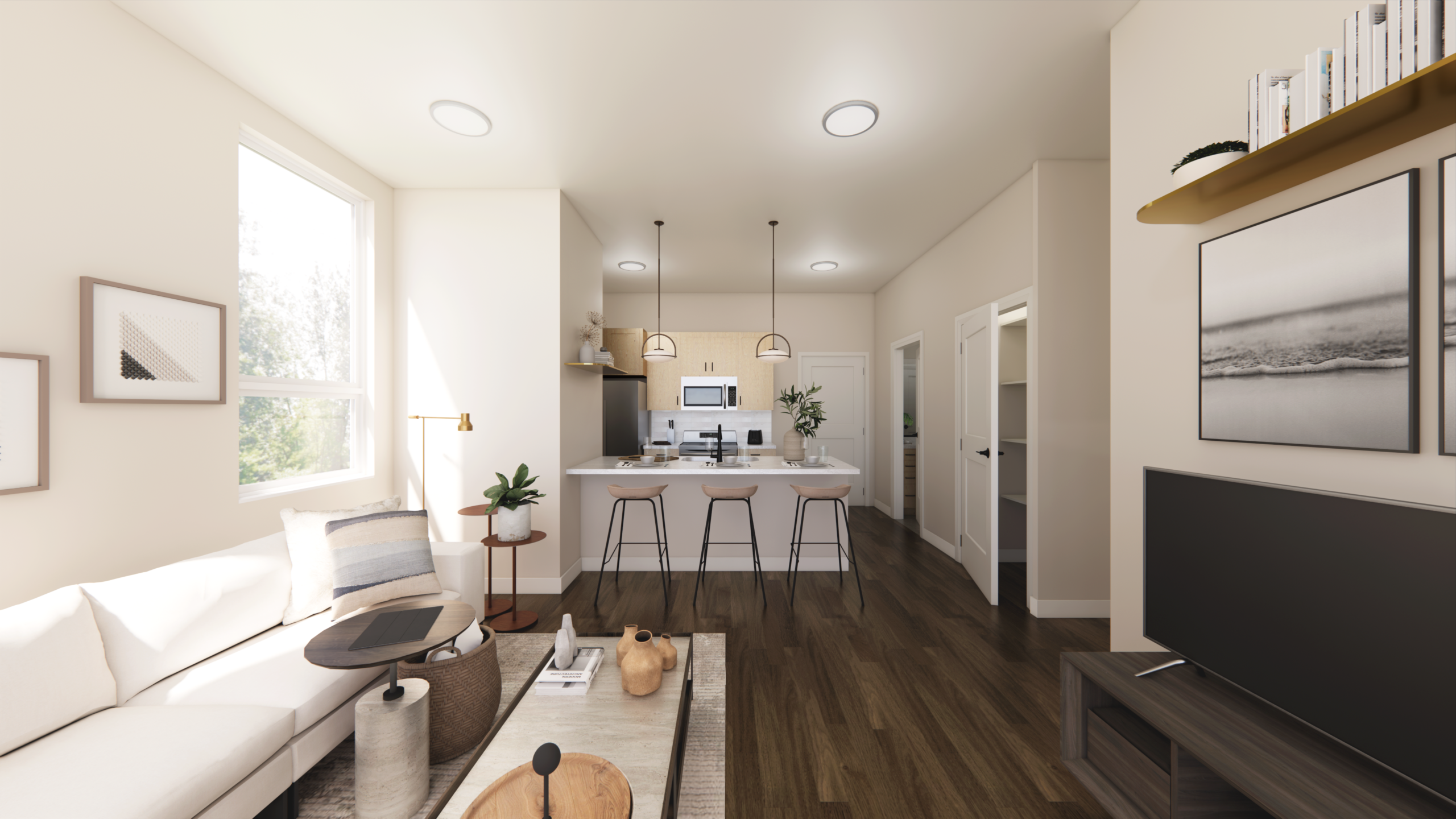 Thrive Companies, Modern open-plan living room and kitchen with neutral decor, wooden flooring, a white sofa, bar stools at a kitchen island, and a TV on a stand. Apartments in Columbus Ohio