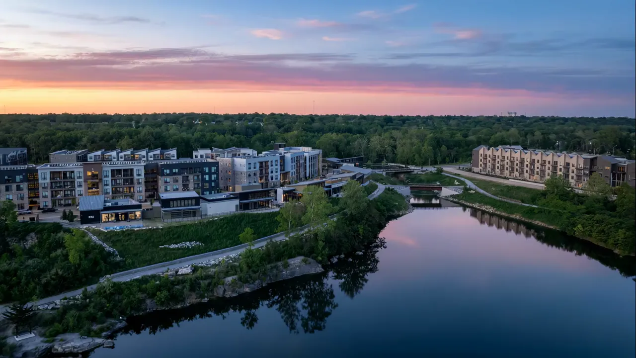 Thrive Companies, Aerial view of apartment complexes along a river at sunset. Apartments in Columbus Ohio