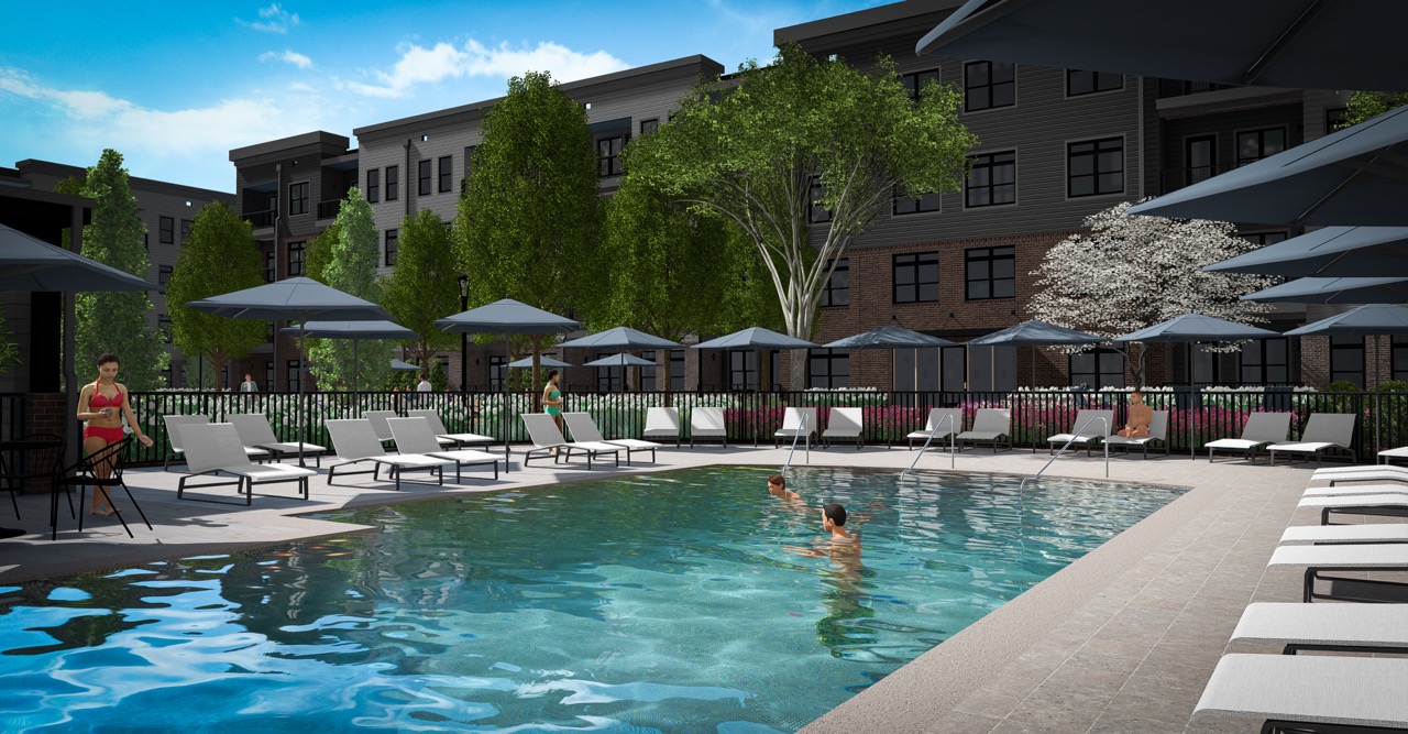 Thrive Companies, Apartment complex outdoor pool with lounge chairs, umbrellas, and a few people relaxing or swimming; trees and the Moore’s Edge building in the background under a partly cloudy sky. Apartments in Columbus Ohio