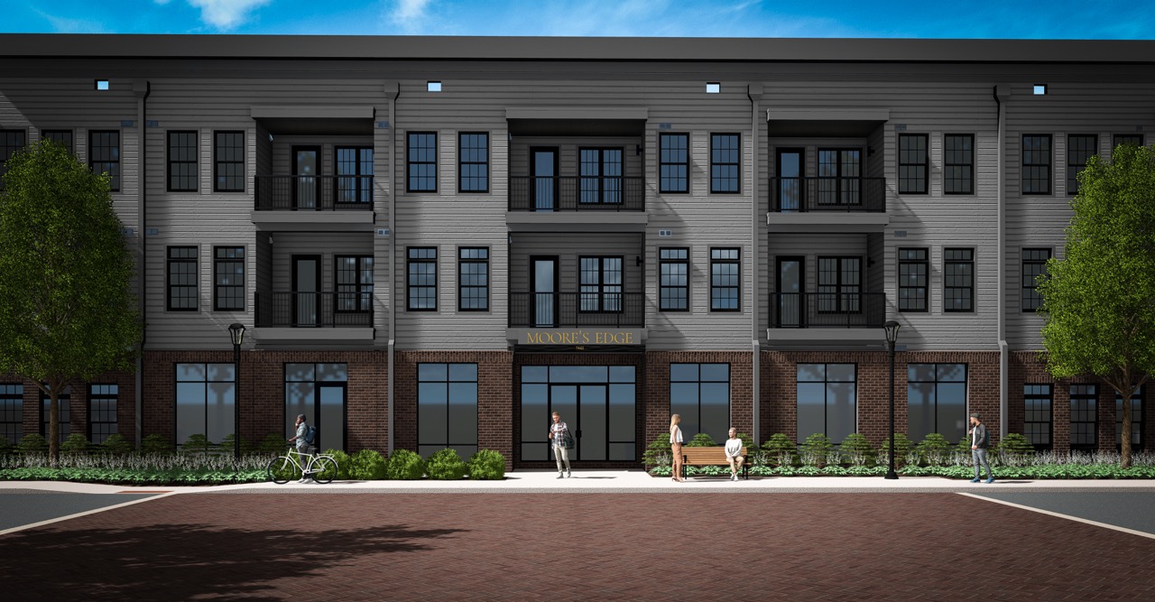 Thrive Companies, Three-story apartment building with balconies, ground-floor storefronts, and people standing or sitting outside on a sunny day at Moore’s Edge. Apartments in Columbus Ohio