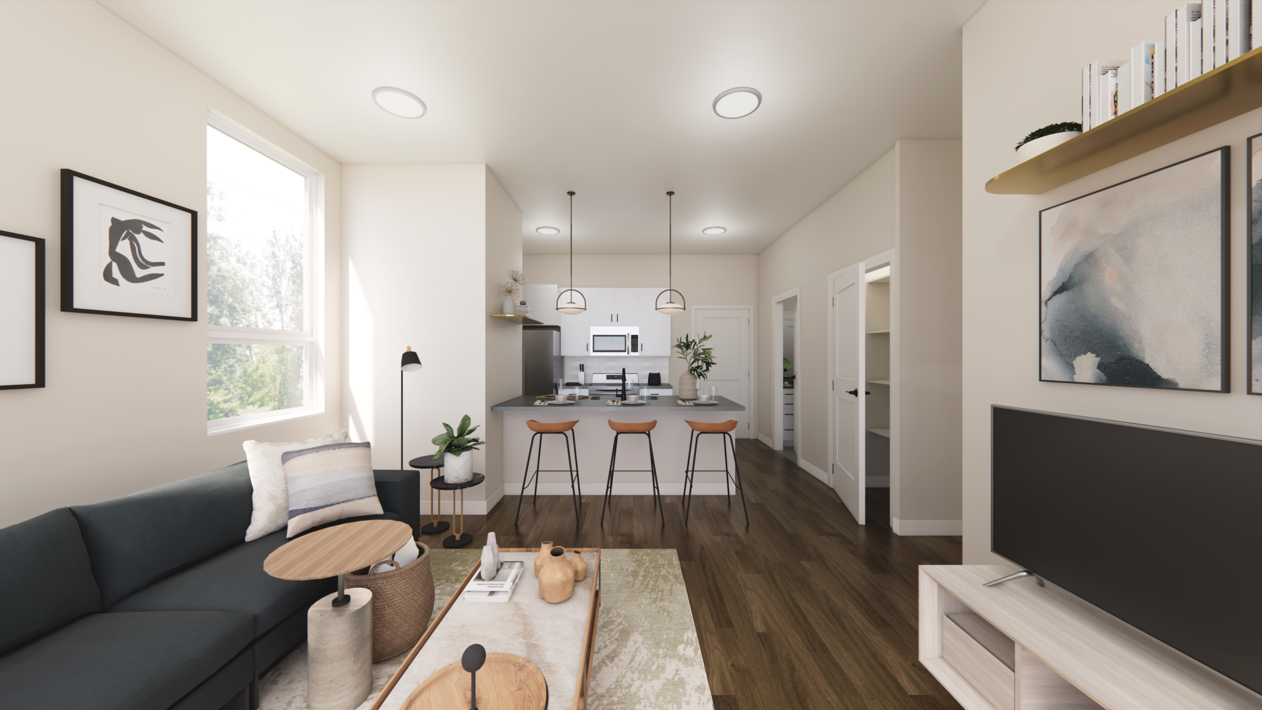 Thrive Companies, Modern open-concept living room and kitchen with a sectional sofa, wall art, a TV, barstools at a kitchen island, and bright natural light from a large window. Apartments in Columbus Ohio